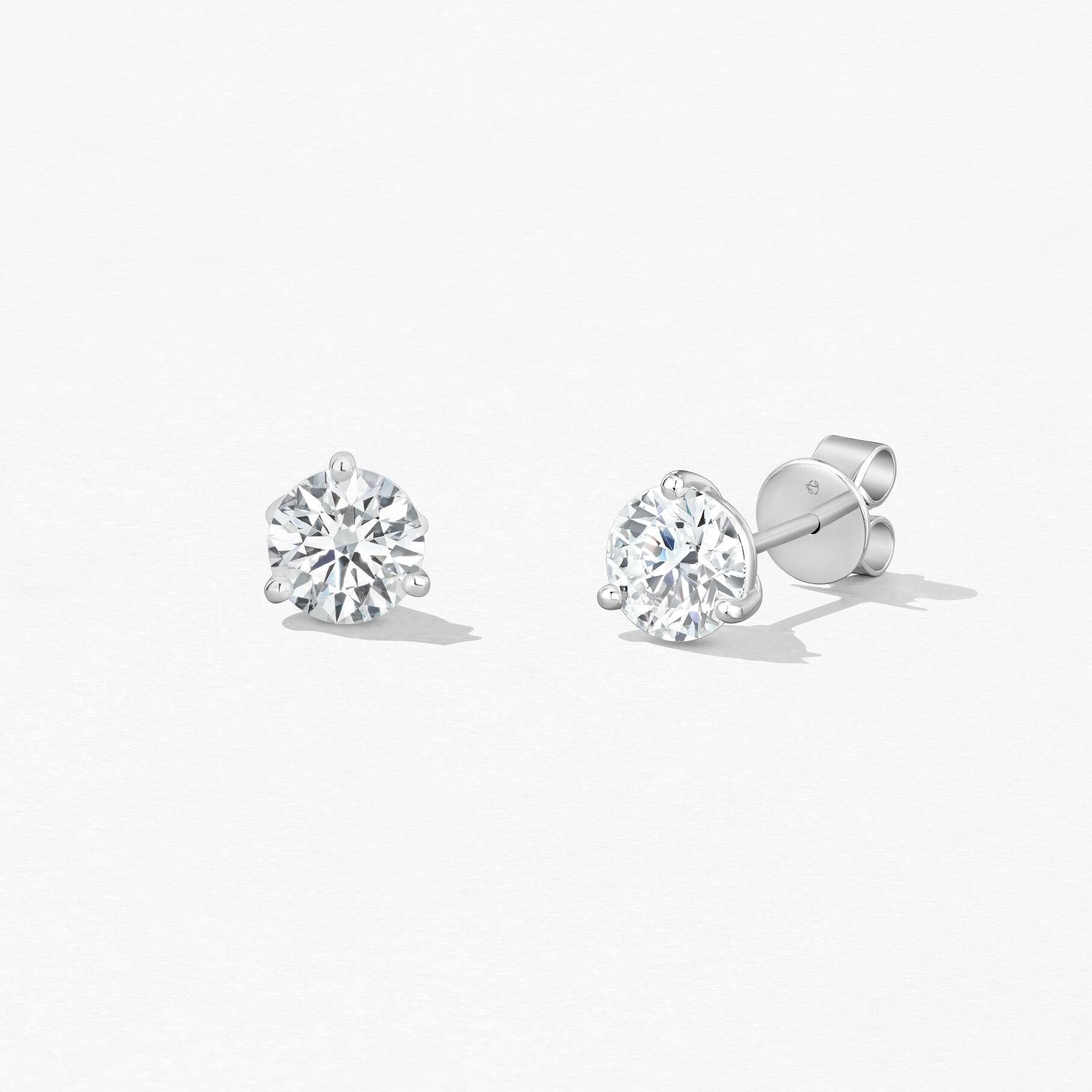 18KW Hearts On Fire Three Prong Diamond Stud Earrings