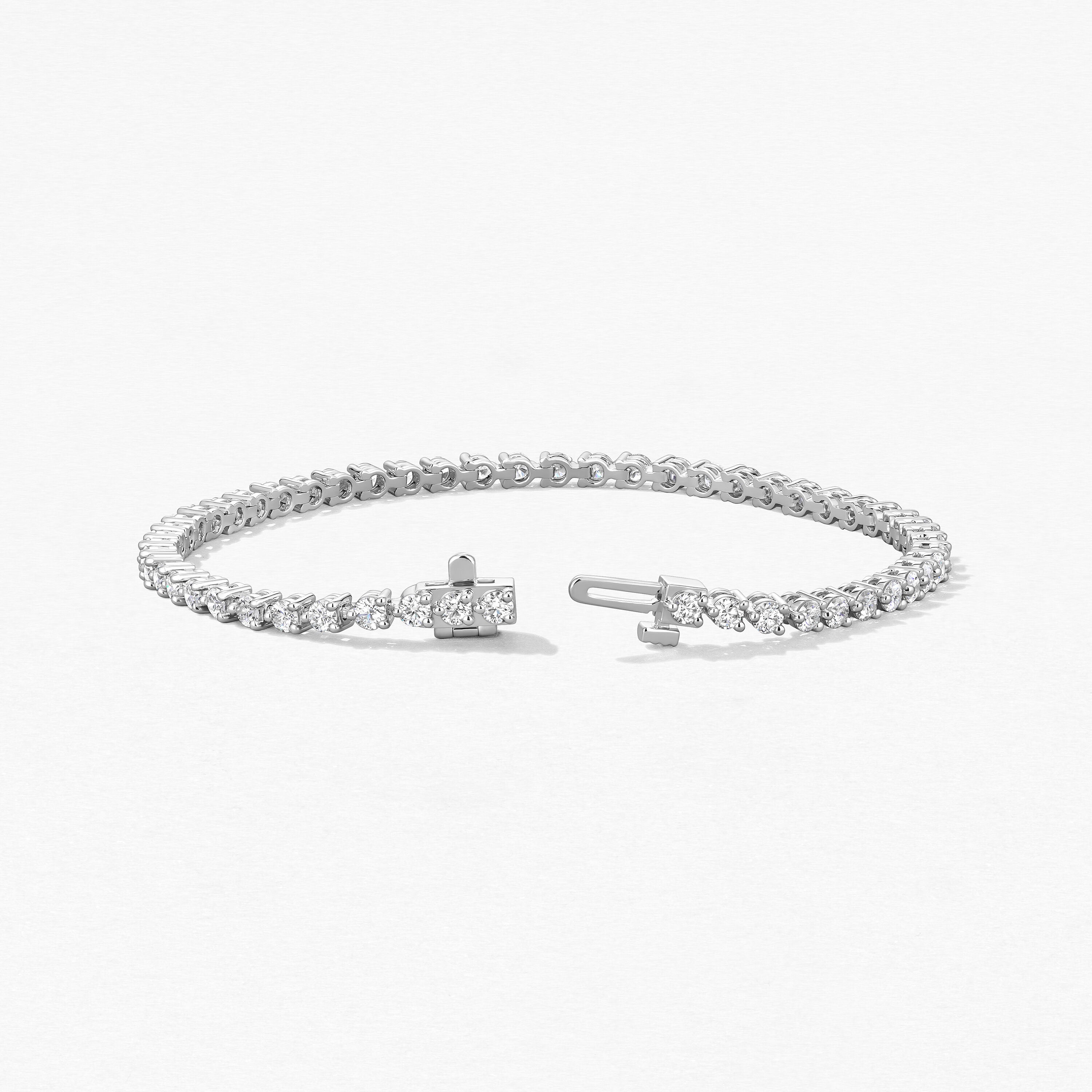 18KW Hearts on Fire "Temptation" Three Prong 3ctw Tennis Bracelet